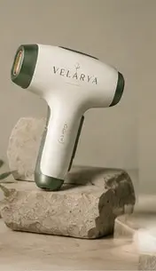 Velárya Nova pulsed light hair removal device in cream and forest green on natural stone